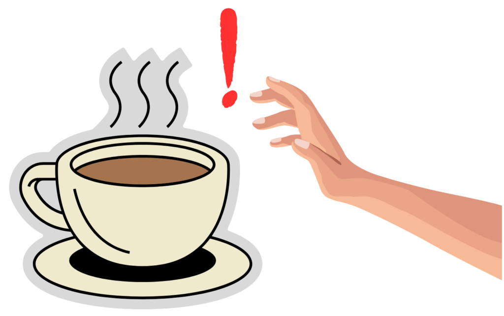 Boy touching a hot cup of coffee, illustrating heat transfer.