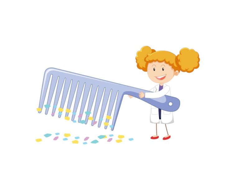 Static electricity demonstration with a comb attracting small pieces of paper