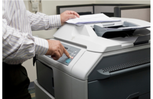 A photocopier and printer machine utilizing static electricity to attract toner particles